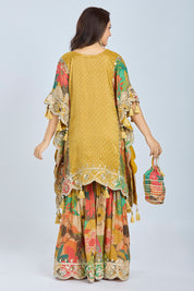 Elegant Mustard Yellow Tissue Banarasi Short Kaftan with Floral Gharara and Potli