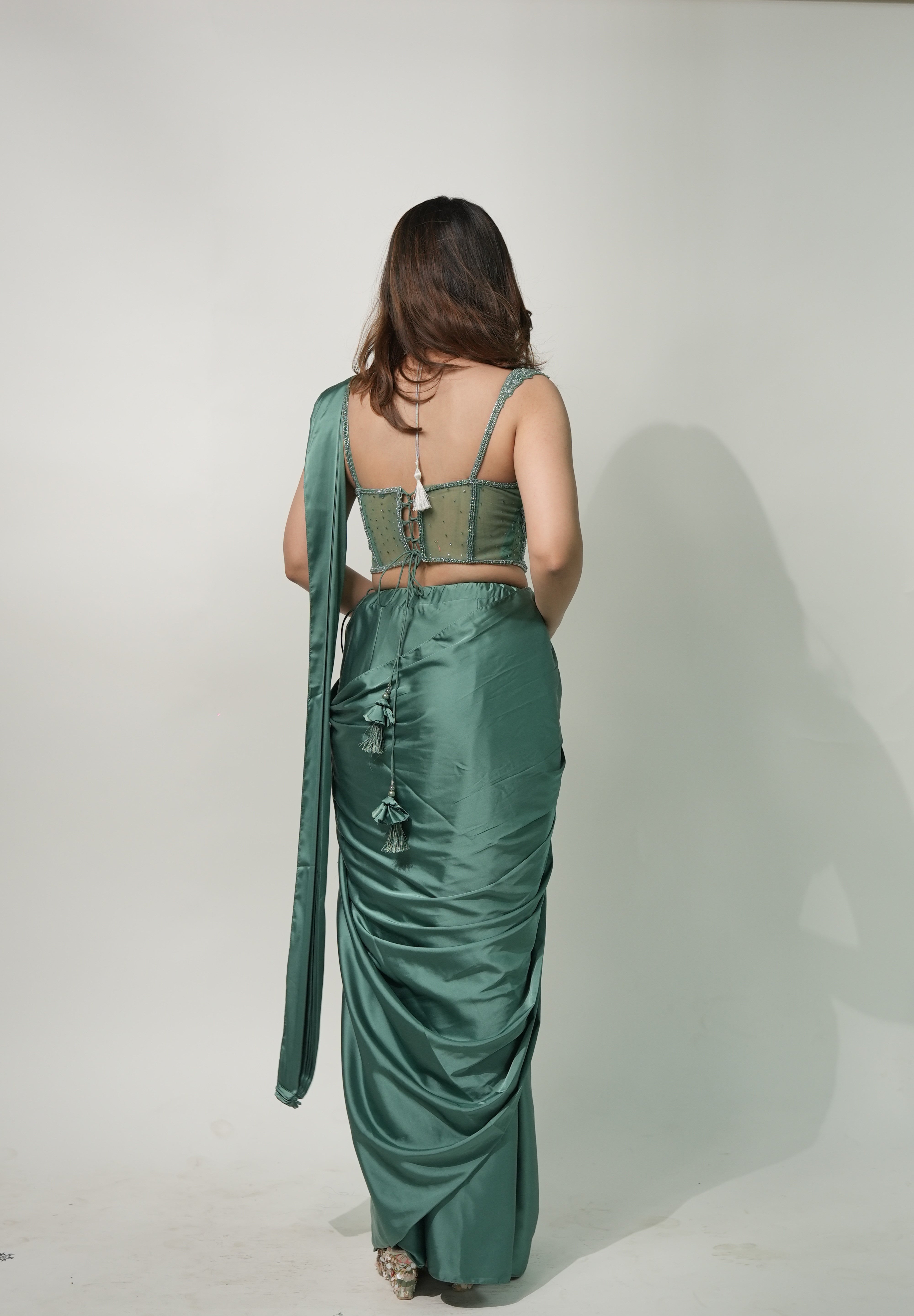 Emerald Elegance Drape Saree with Corset Blouse